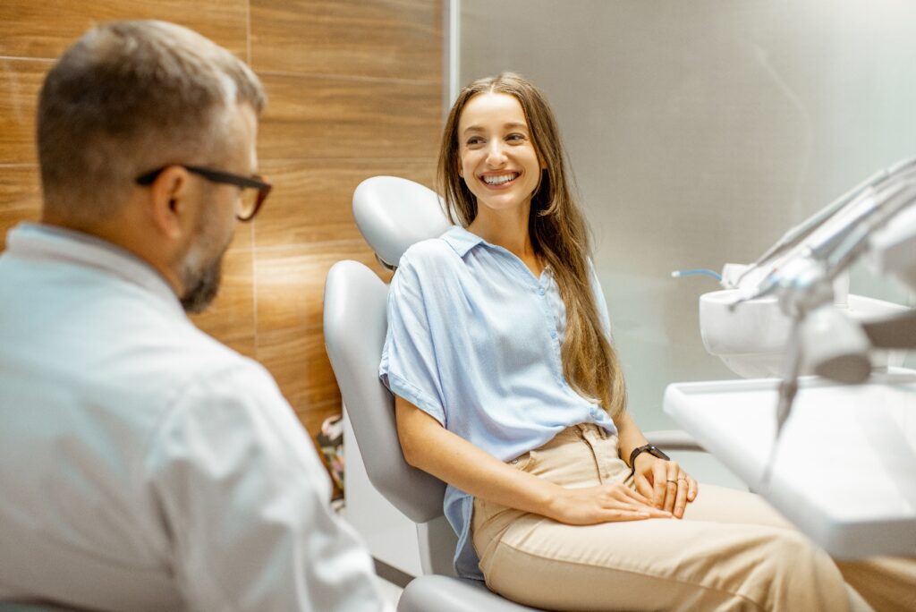 Lady smiles at dentist